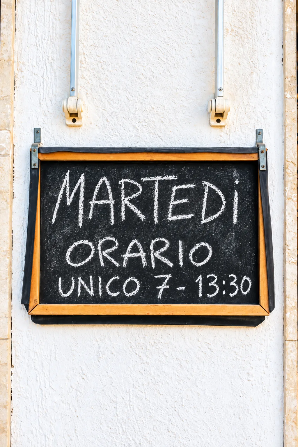Opening hours displayed at the entrance